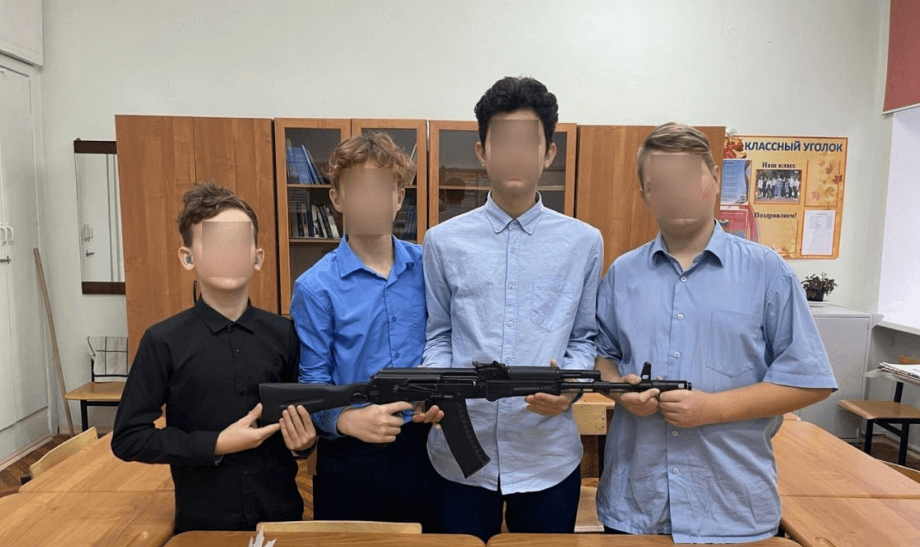 Russian schoolchildren handed Kalashnikov rifles in class in honor of the weapons designer’s 105th birthday