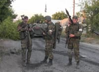 From left to right: Aleksandr "Harry" Dergachov (Rusich group grenadier), Motorola, and Yan Petrovsky