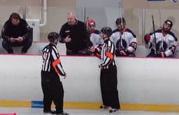 Igor Musatov coaches a hockey game