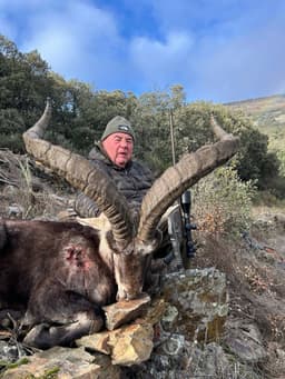 Vasily Shestakov posing with a dead animal in Spain