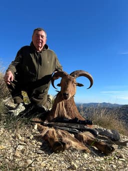 Vasily Shestakov posing with a dead animal in Spain
