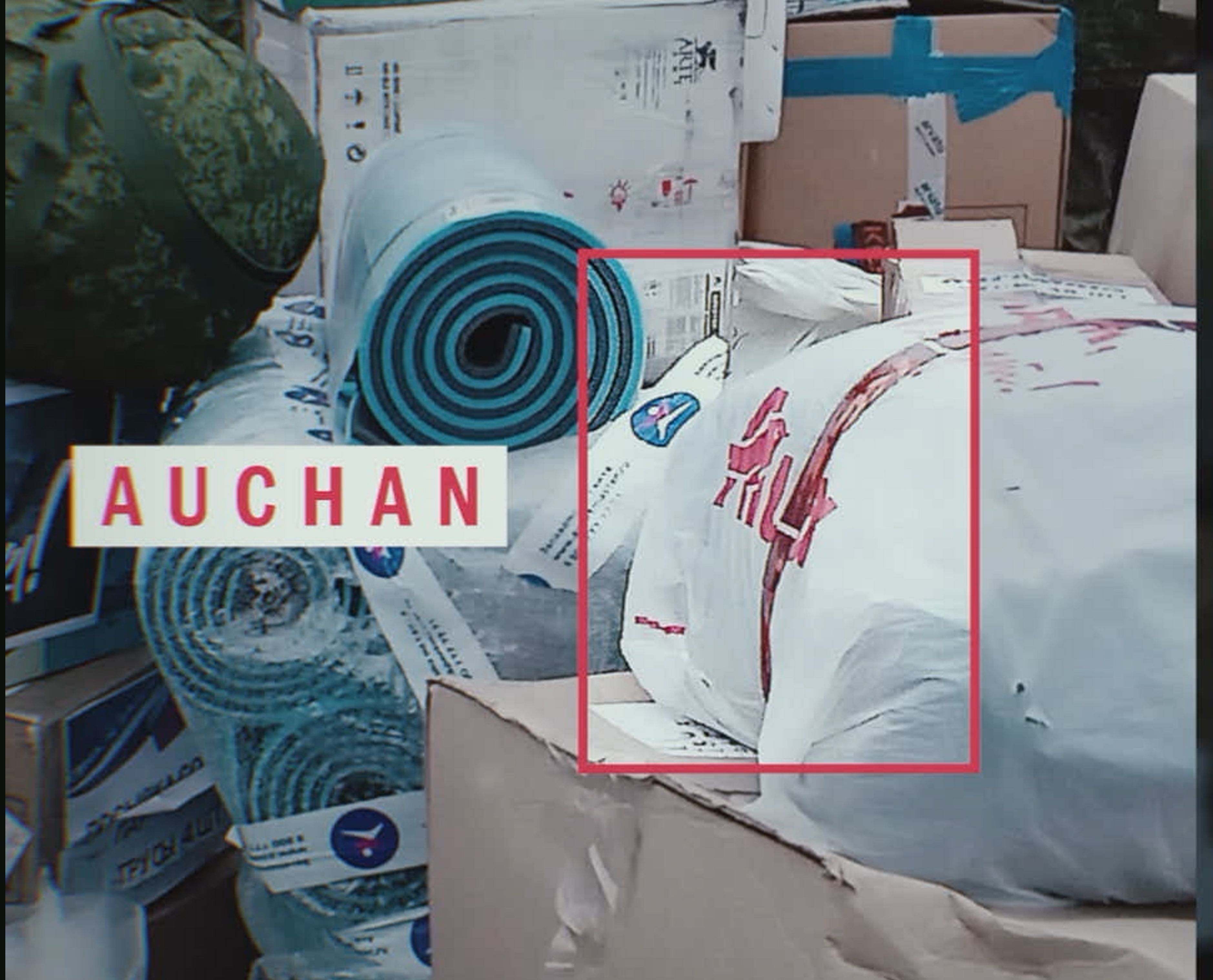 In the video, where the Russian servicemen are thanking volunteers for their help, you can see items in Auchan's branded packaging
