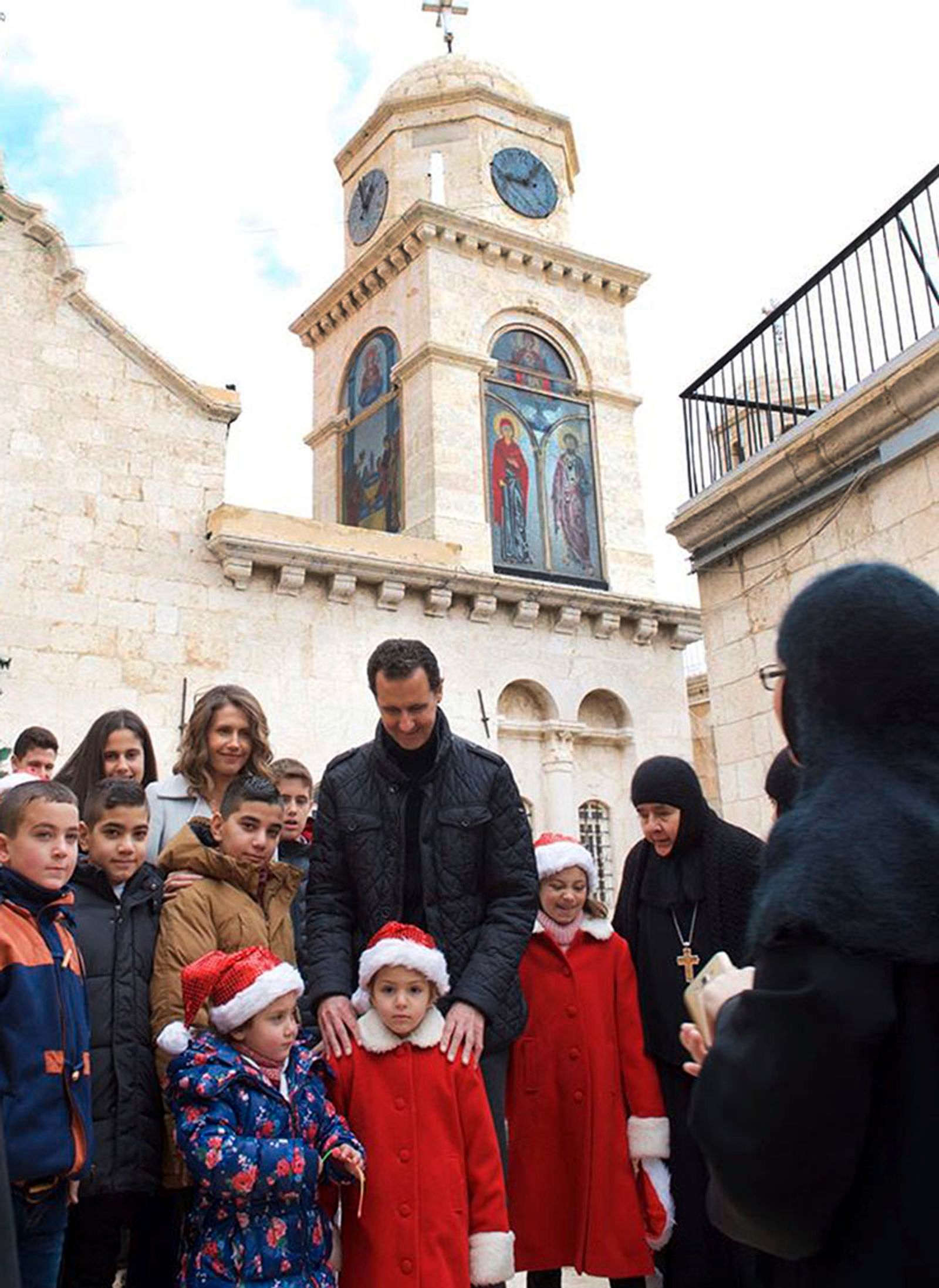 Bashar al-Assad in a Christian church with parishioners, Christmas Day, 2016