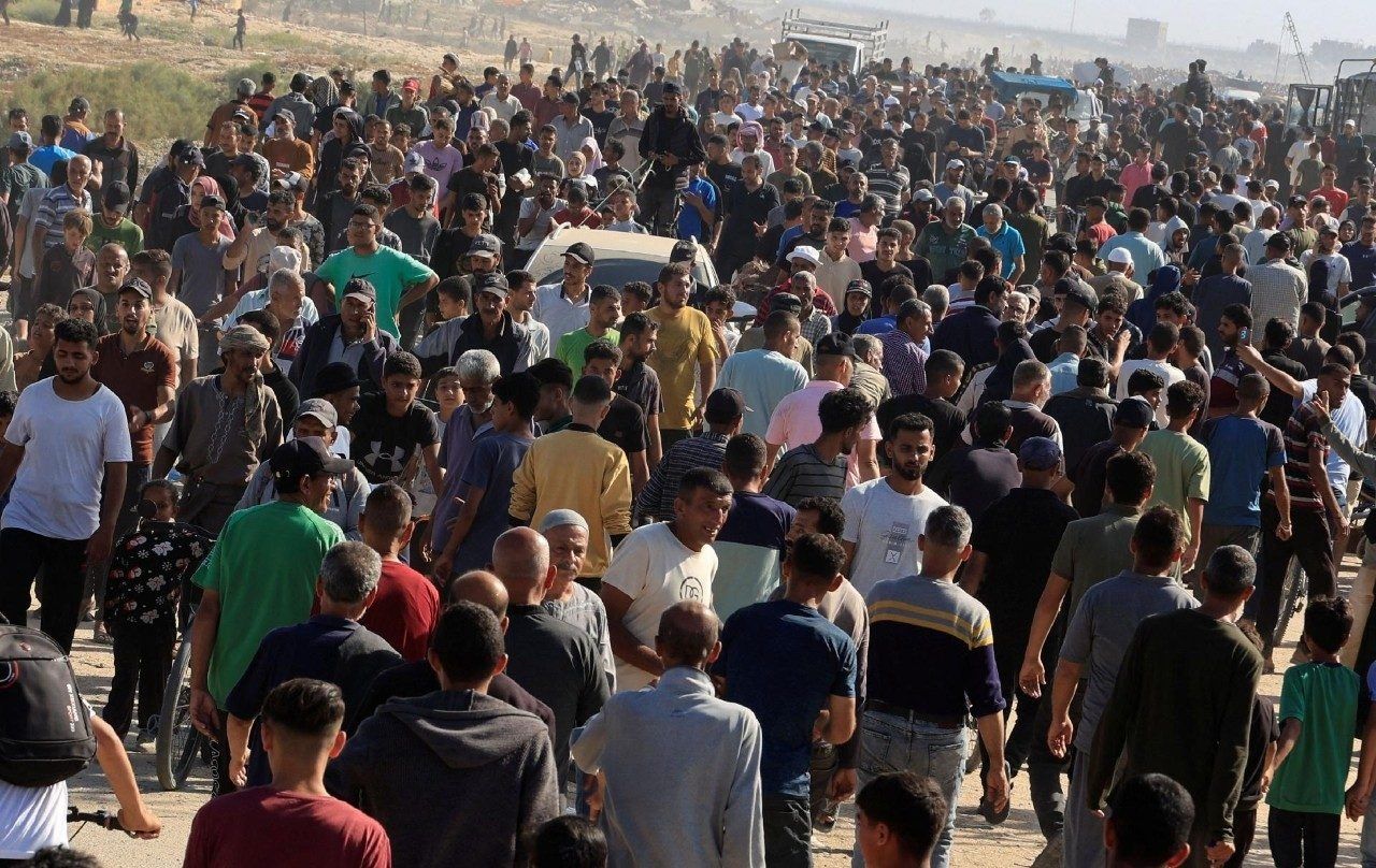 Palestinians at a humanitarian aid distribution point in Rafah