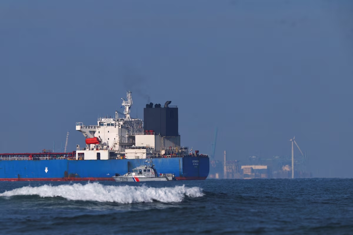 The detained tanker Grinch being escorted by French vessels. Photo: Manon Cruz / Reuters